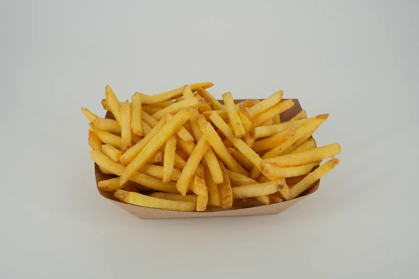 Goldene BUNEX Pommes in einer Schale